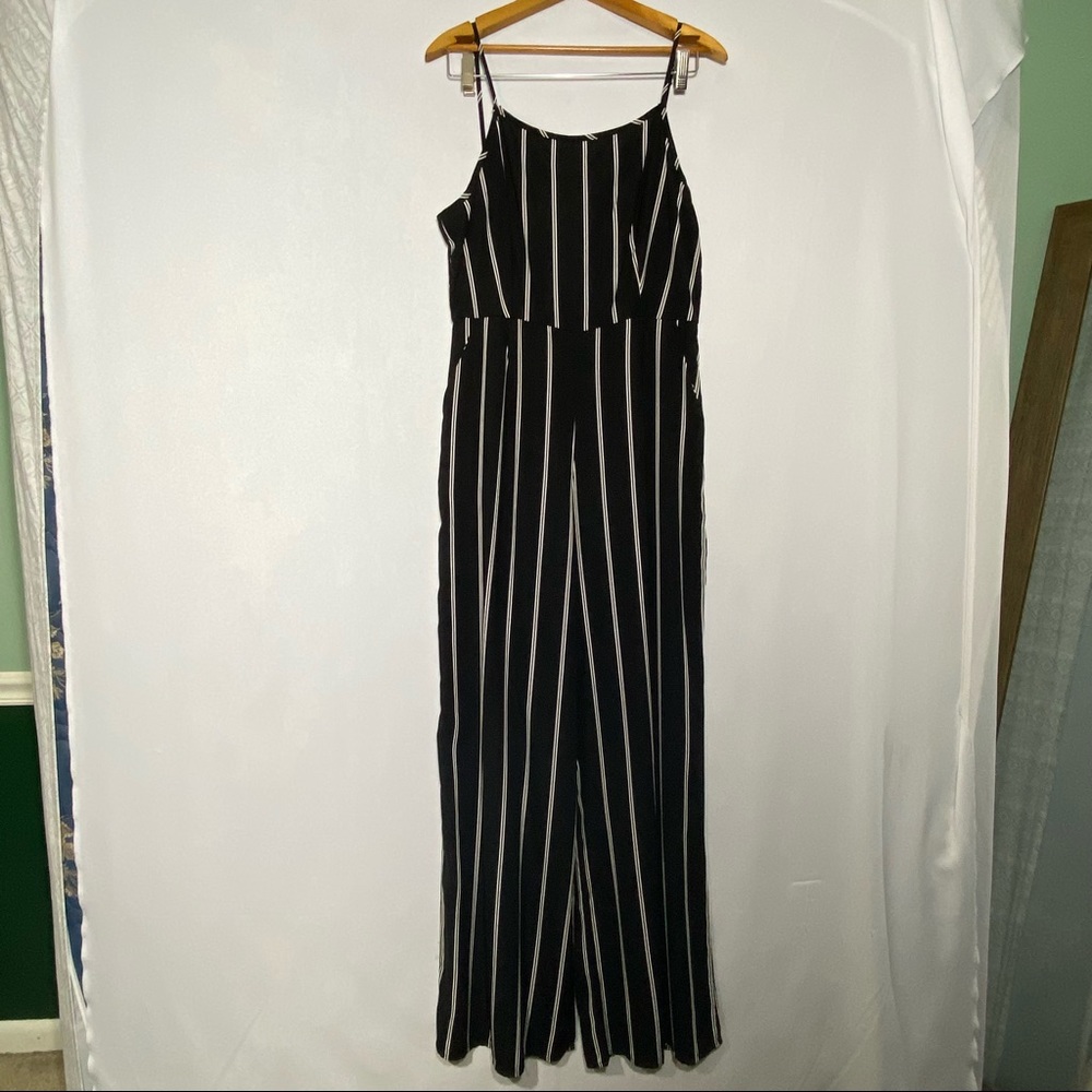 Urban outfitters jumpsuit, black w/white stripes.  Size L